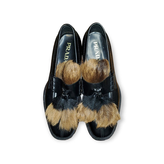 Prada SPAZZOLATO GOAT-FUR TASSEL LOAFER IN F0889 NERO + NATURAL