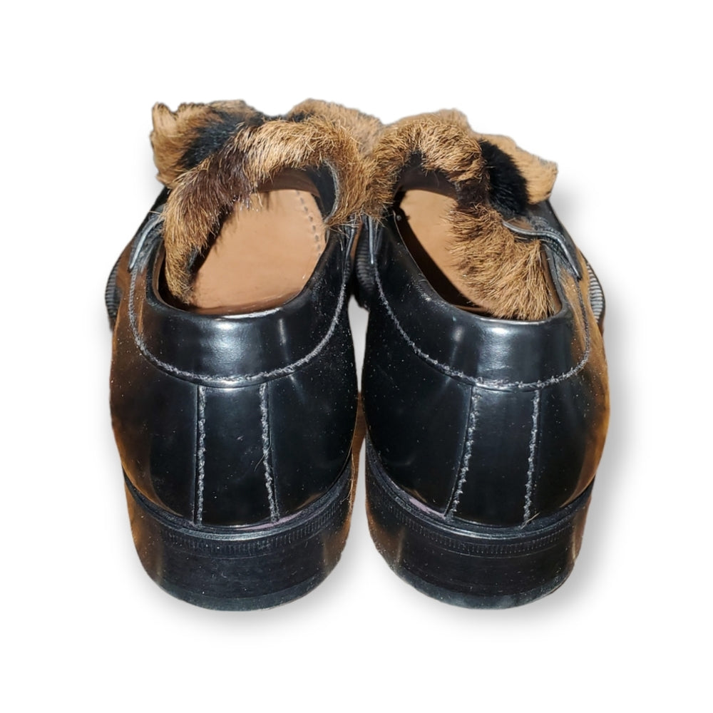 Prada SPAZZOLATO GOAT-FUR TASSEL LOAFER IN F0889 NERO + NATURAL